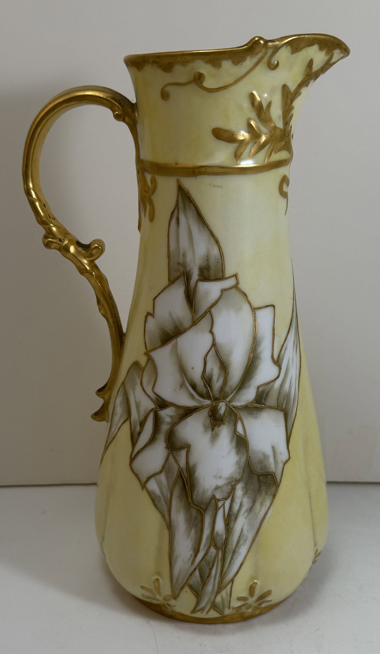 Haviland Limoge French Art Nouveau Porcelain Pitcher, late 19th Century: Marked CFH GDM for Charles Field Haviland and his partners, Gerard, Dufraisse, and Morel, the decorator signed the underside S.C. Watts. Height: 10 1/4 inches, Width: 5 3/4 inches with the handle, Dia