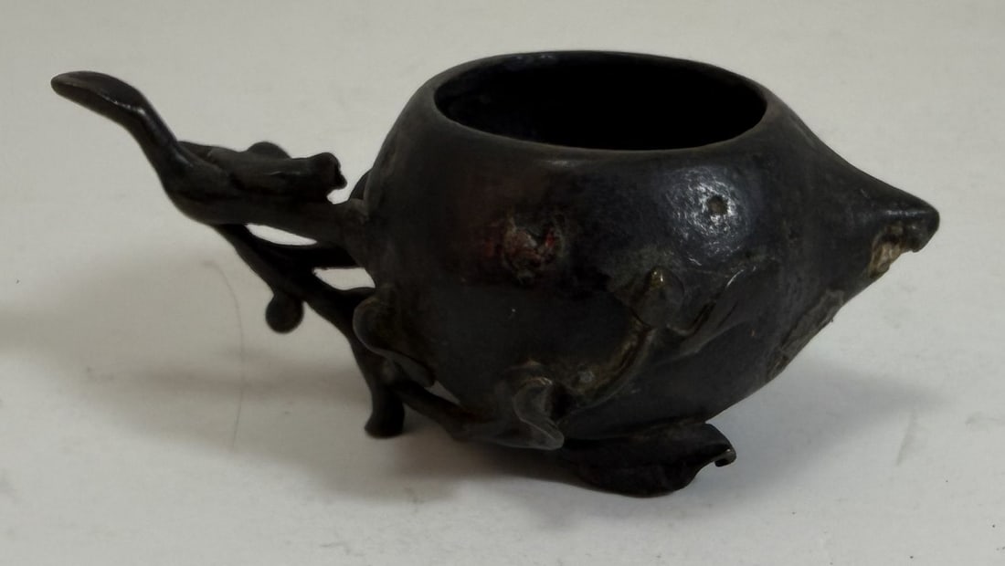 Chinese Bronze Peach Form Water Coupe, Qing dynasty: Scholars object. Length: 3 3/8 inches, Height: 1 1/2 inches. Weight: 2.4 oz.