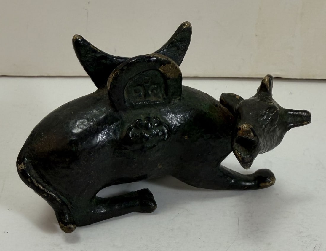 Asian Bronze Deer Form Mirror Holder, 19th Century: Some rubbing to the patina. Length: 3 1/2 inches, Width: 2 inches, Height: 2 1/4 inches. Weight: 7.6 oz. This item is at our New York location.