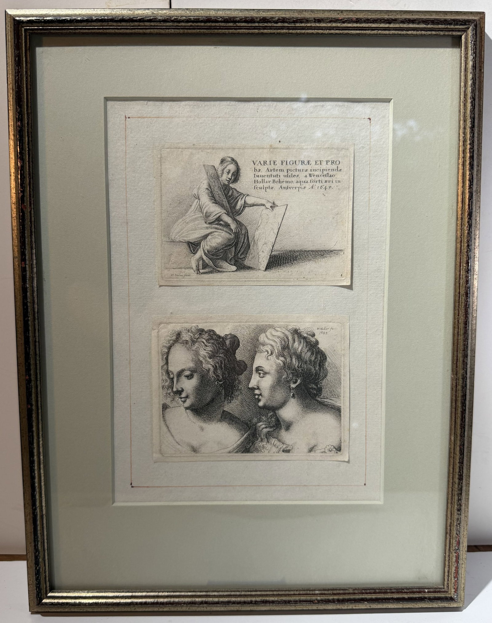 Two European Etchings, dated 1645: Framed, One inscribed Antwerp and dated 1645; the other with two female portraits, signed W. Moller Fecit, and dated 1645. Image size 10 by 6 1/2 inches, overall 14 3/4 by 11 1/4 inches. Weight: 1 lb.