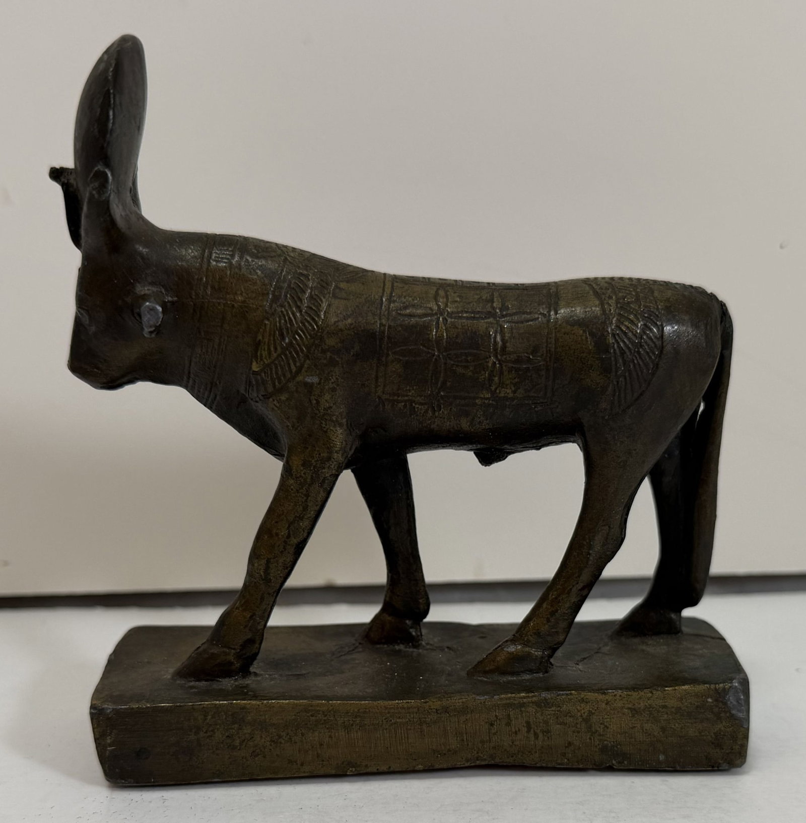 Cast Bronze Egyptian Style Figure of Apis the Bull: A replica of an original in an Egyptian Museum. Height: 4 3/4 inches, Length: 4 1/2 inches, Depth: 1 1/2 inches. Weight: 2 lbs. 13 oz. This item is at our New York location.