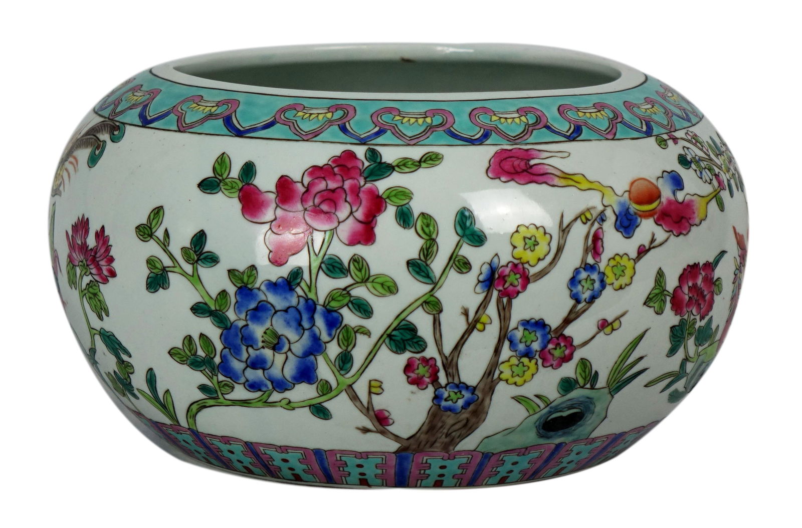An Export Famille Rose Chinese Porcelain vase Chinese: An Export Famille Rose Chinese Porcelain vase Chinese export famille rose with flowers and trees Height: 6 in, Width: 11 in, Base Width: 7.25 in Color White, Blue, Purple, Green, Yellow