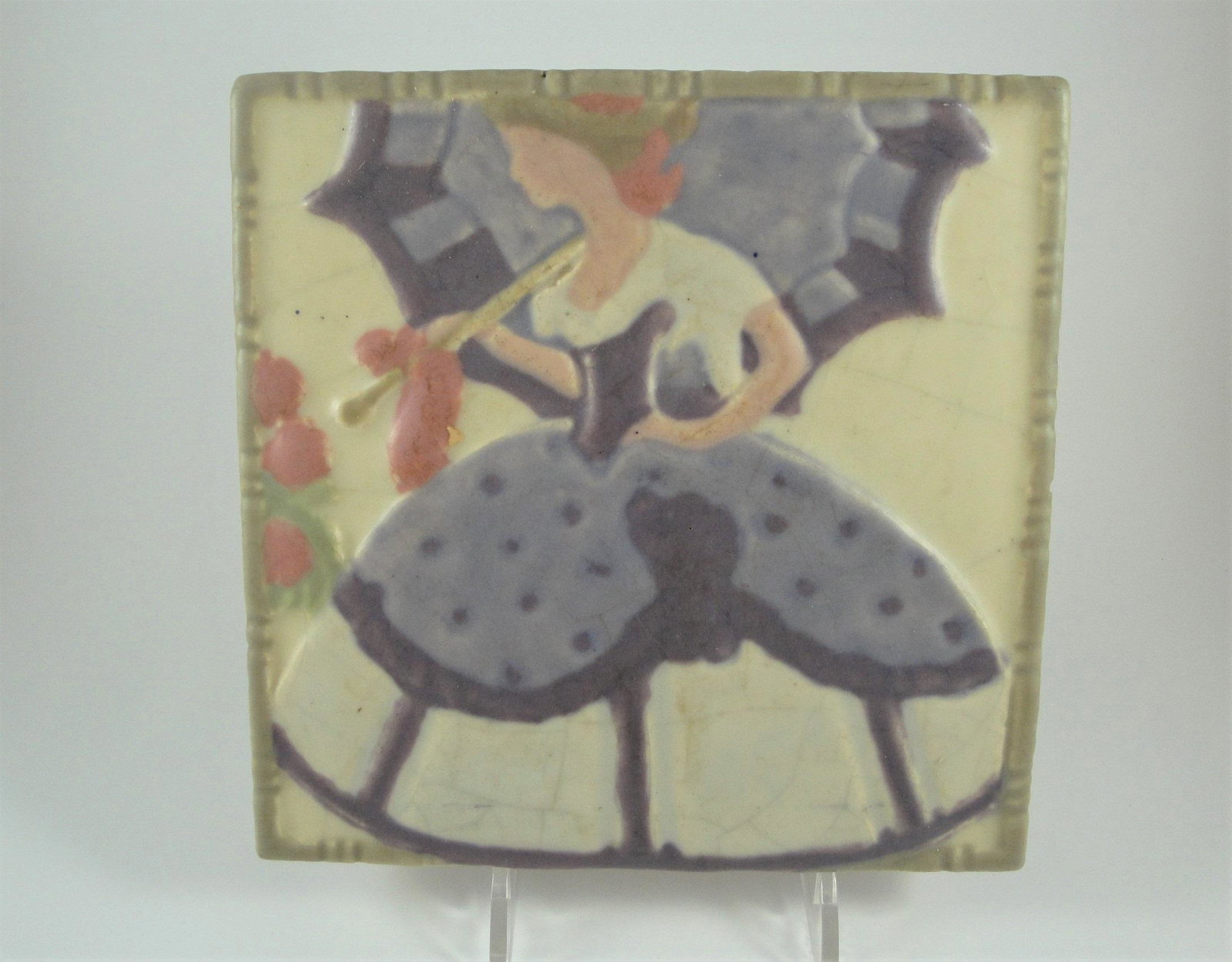 Rookwood Polychromed Relief Tile, Circa 1920.: Rookwood polychromed art tile of southern belle with parasol in velum glaze, circa 1920, with impressed numbers to back, 6 in. square x 5/8 in depth.