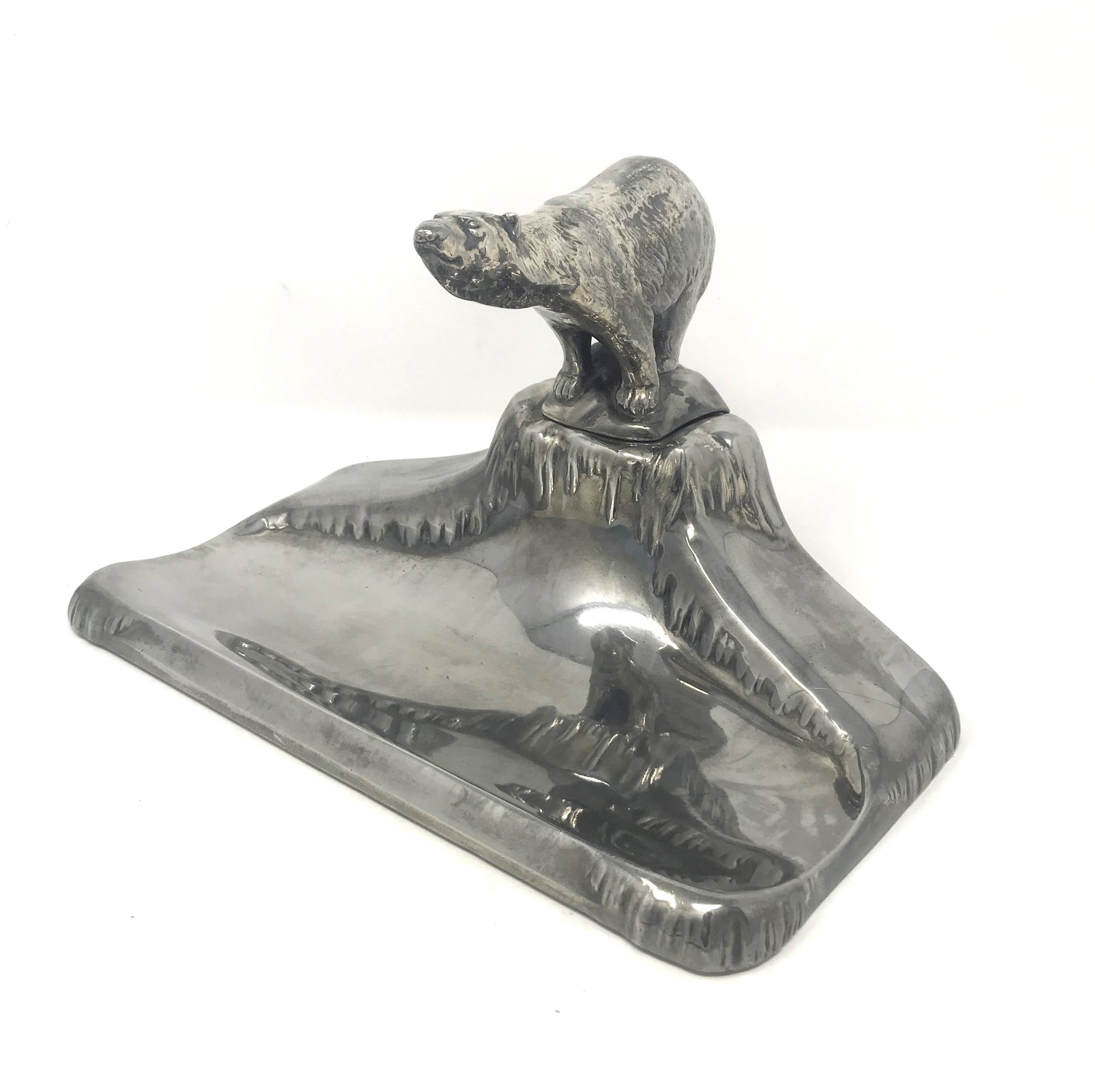 A Danish Silver Plated Inkstand with Polar Bear Finial, c. 1930's.: An impressive and large, silver plated inkstand in a Polar Bear on an ice cap design. The hinged bear opens to reveal an original glass ink pot inset, several marks and intials on lower back of base i