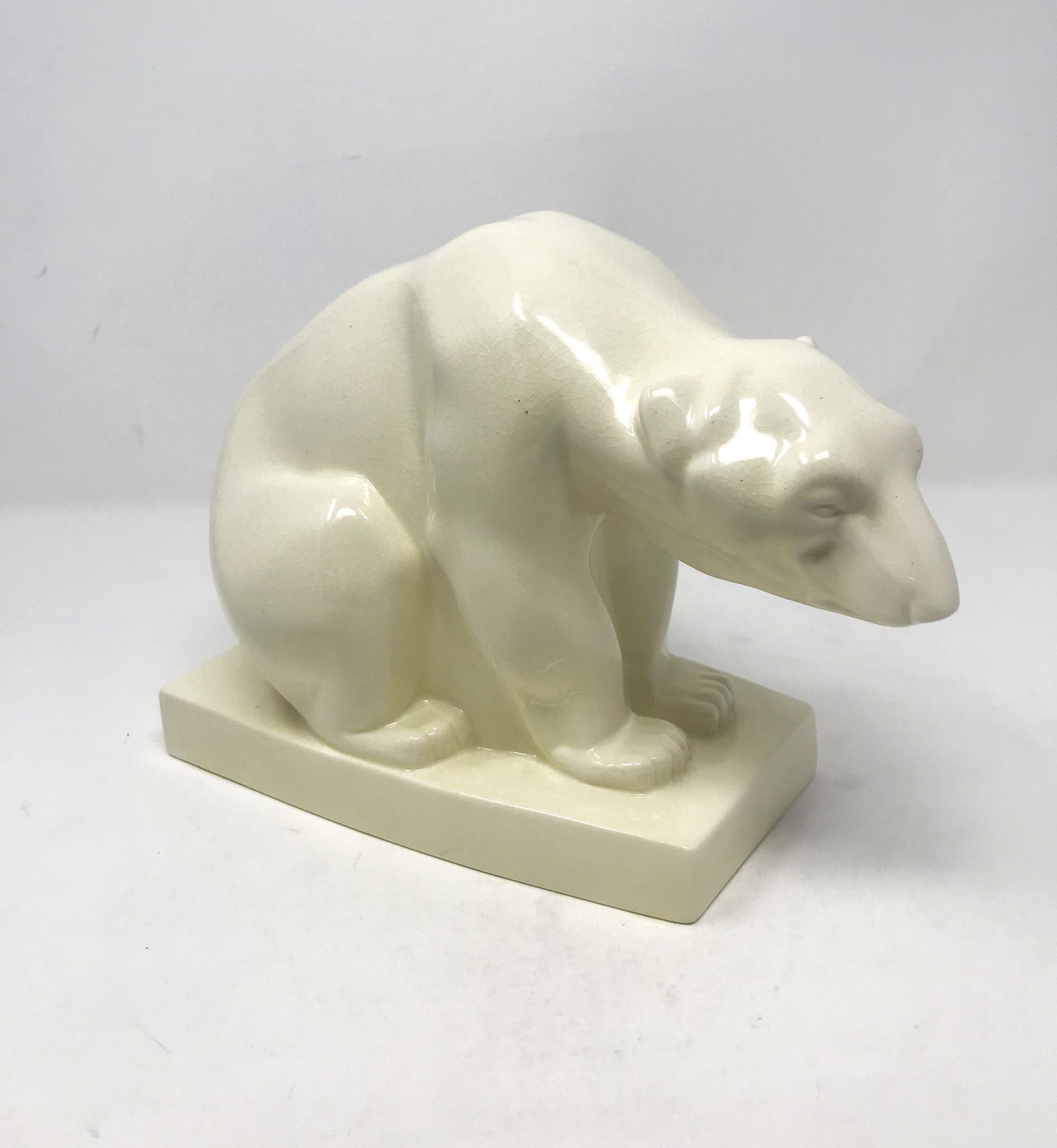 John Skeaping for Wedgewood, Art Deco Ceramic Polar Bear Sculpture, circa 1930's.: A ceramic Art Deco stylized polar bear in white glaze designed by John Skeaping in 1927, and made for the Josiah Wedgwood & Sons, Barlaston, England. Produced in limited quantities in the 1930s – 19