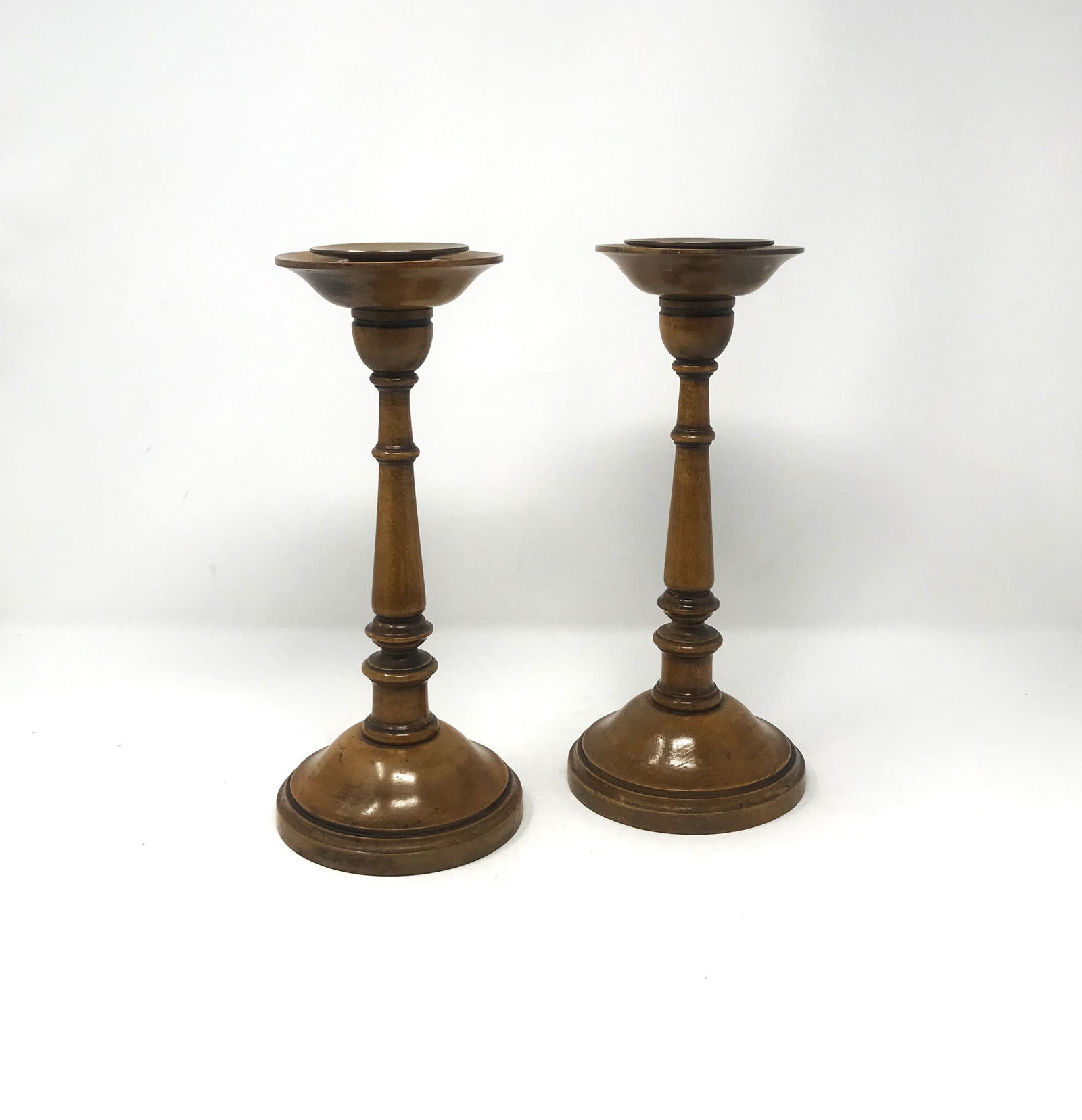 Pair of English Beechwood Candlesticks, c. 1810.: A wonderful and scarce pair of English Beechwood, turned candlesticks circa 1810. Both with original hand made brass "drip guards" inserts and felt bottoms, dimensions: 11 in. height x 5 in. base widt
