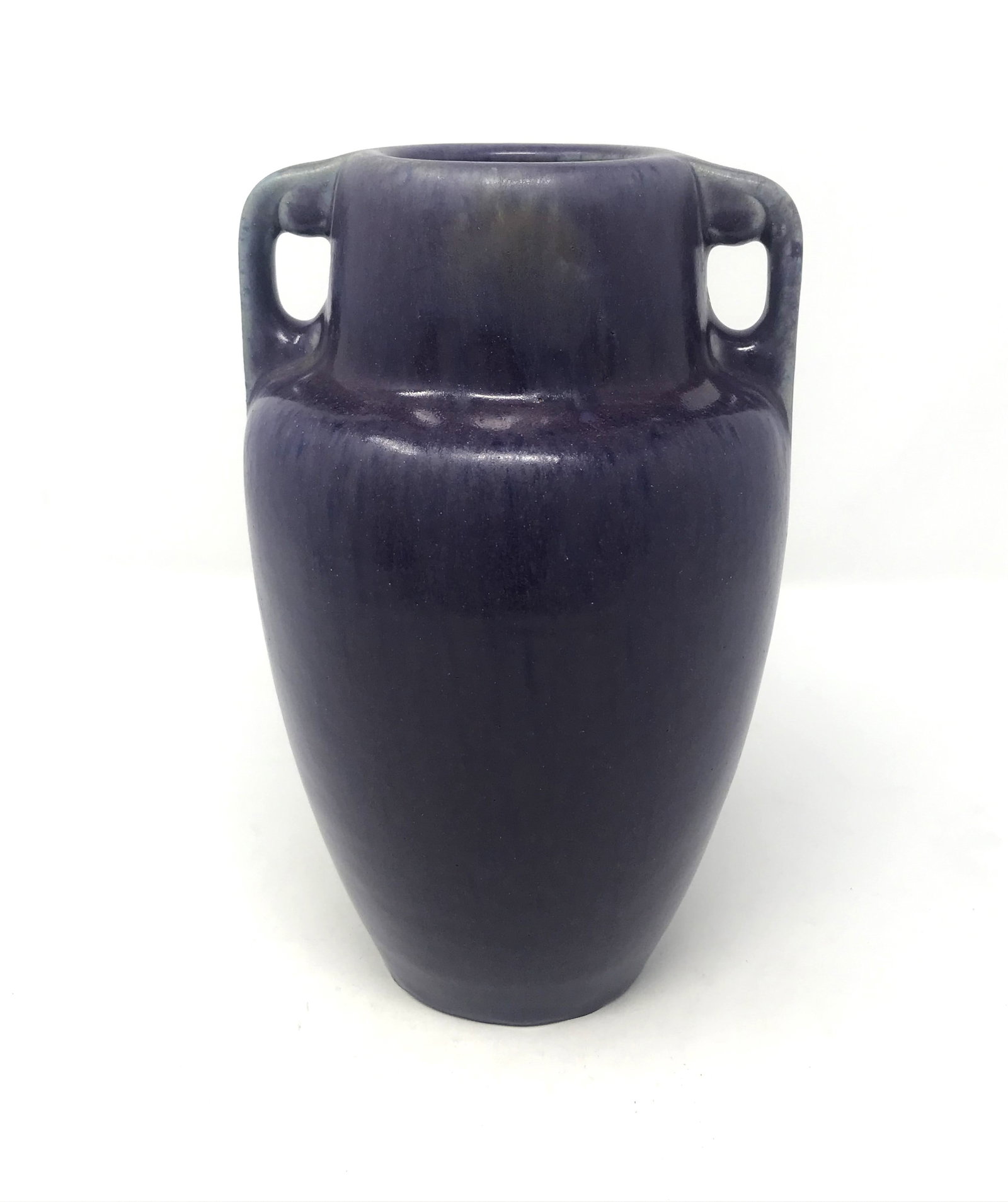 Fulper Pottery Matte Purple Two-Handled Vase c. 1917.: A nice period Arts and Crafts two-handled vase by Fulper Pottery in matte purple-violet colored glaze, model #659, circa 1917, dimensions: 9 in. tall x 5 1/2 in. wide, incised oval "racetrack" mark to