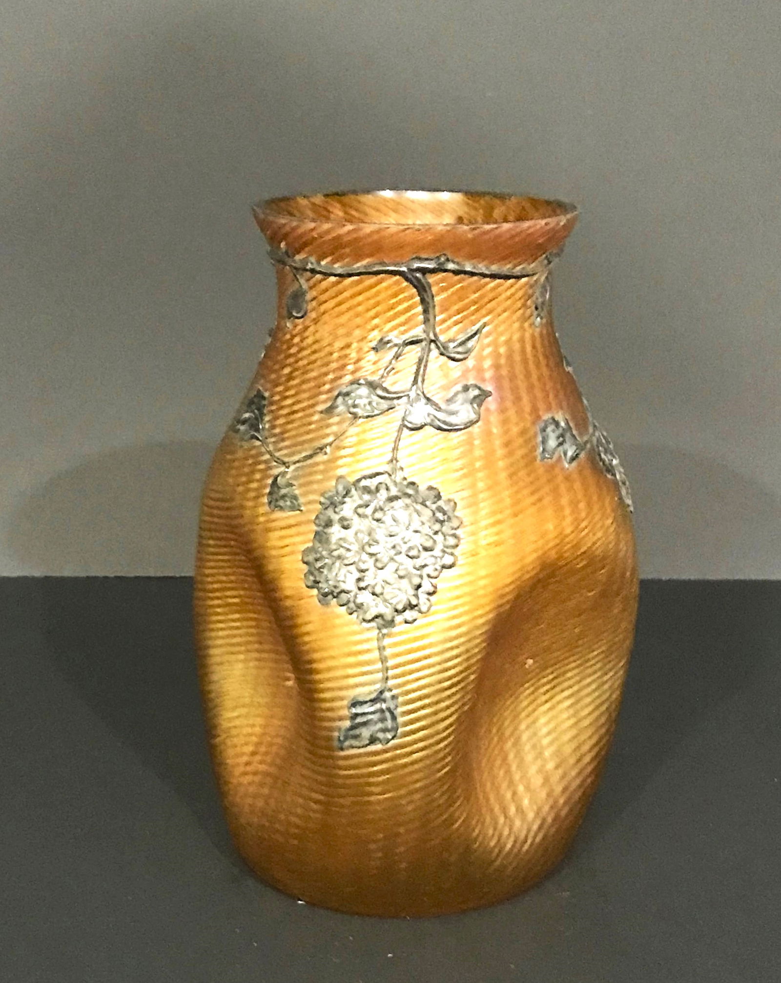Loetz Iridescent Vase with Applied Décor.: An early 20th Century Loetz (attributed) pinched-sided, blown glass, iridescent vase with applied "metallic" glass décor of "flowers, leaves and stems" design. Loetz Metallglas décor, the bo