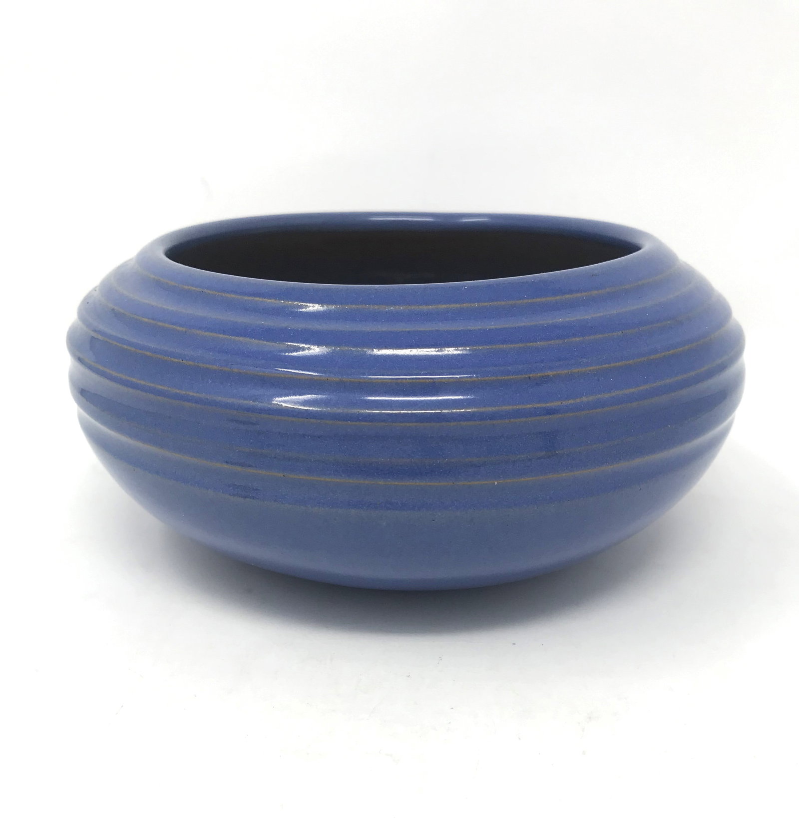 A 1929, University Of North Dakota School Of Mines Low Bowl.: A UND low bowl with stepped design by Julia Matson, in blue glaze with darker blue over glaze and beige interior glaze. Dimensions: 7 in. diameter x 3 1/4 in. tall, Bottom stamped with UND circular in