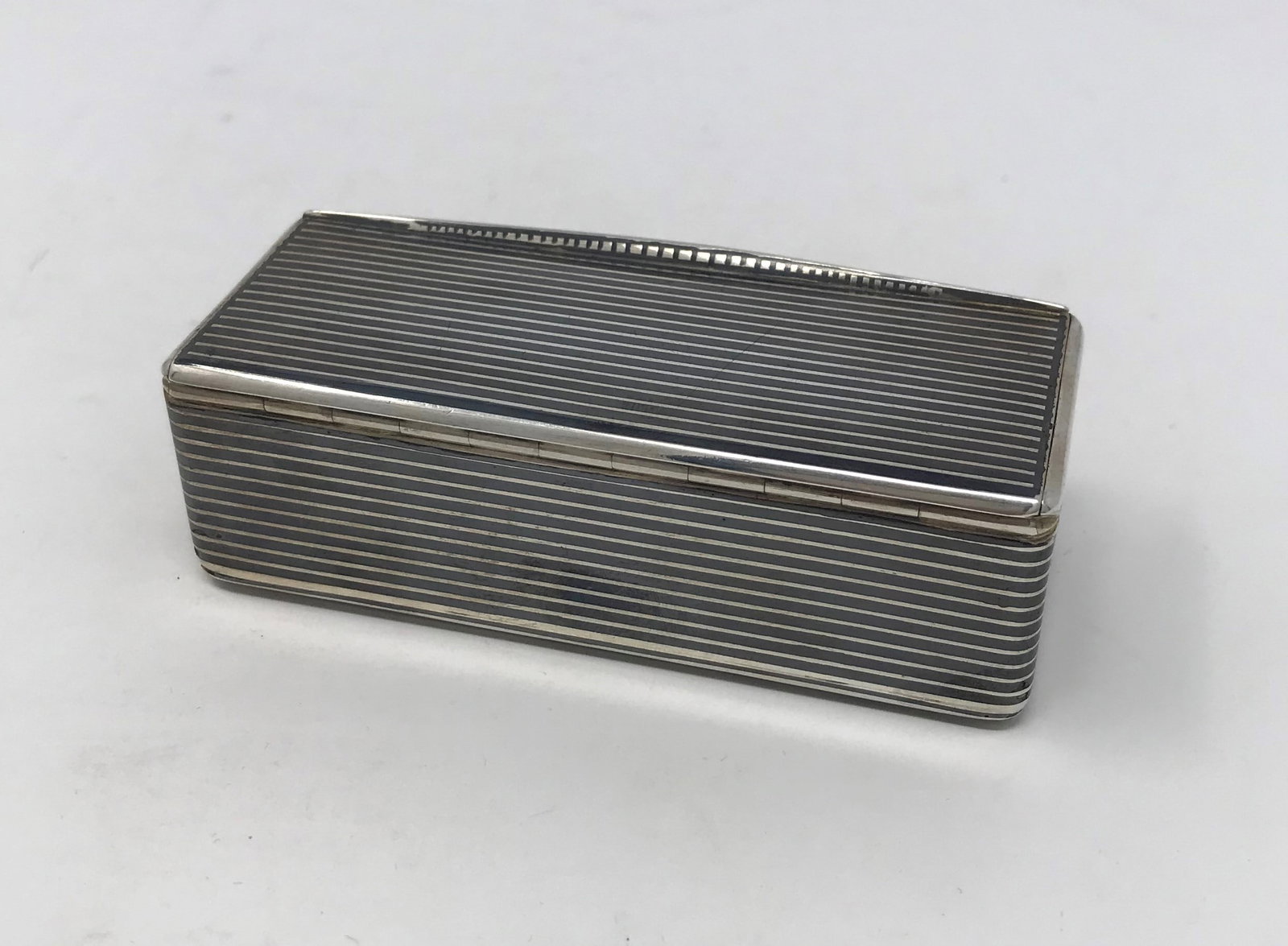 French Silver and Enamel Box: A beautiful and superbly made French silver and black enamel rectangular-shaped, small box by the Paris firm of Lombard & Bernier (1878-1884). Box interior with original lustrous gilting. Fully marked
