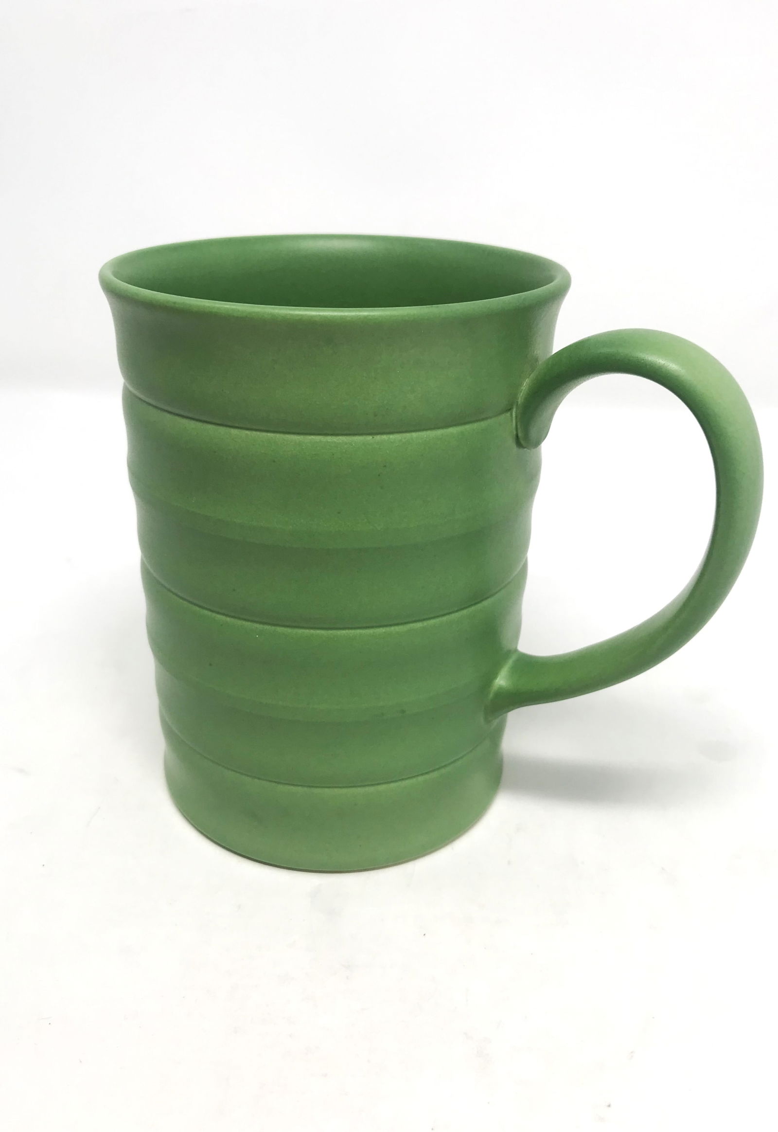 Keith Murray for Wedgewood Ceramic Mug, c. 1936.: A modernist design ceramic mug with ribbed decoration in light green matt glaze by Keith Murray for Wedgewood, circa 1936, size: 4 7/8 in. height x 5 1/4 in. width (including handle), fully hallmarked