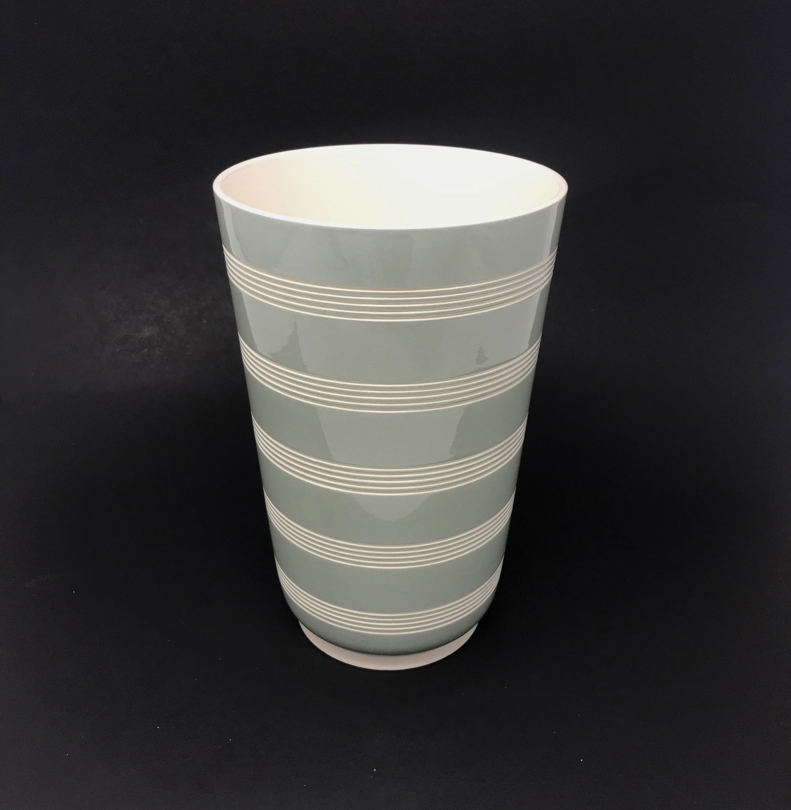 Keith Murray for Wedgewood Modernist Vase, c. 1940.: A fine ceramic vase designed by Keith Murray for Wedgewood in a celadon green glaze to a cream ground with five bands of engine turned incised rings, shape 4217, circa 1940. Fully marked on bottom wit