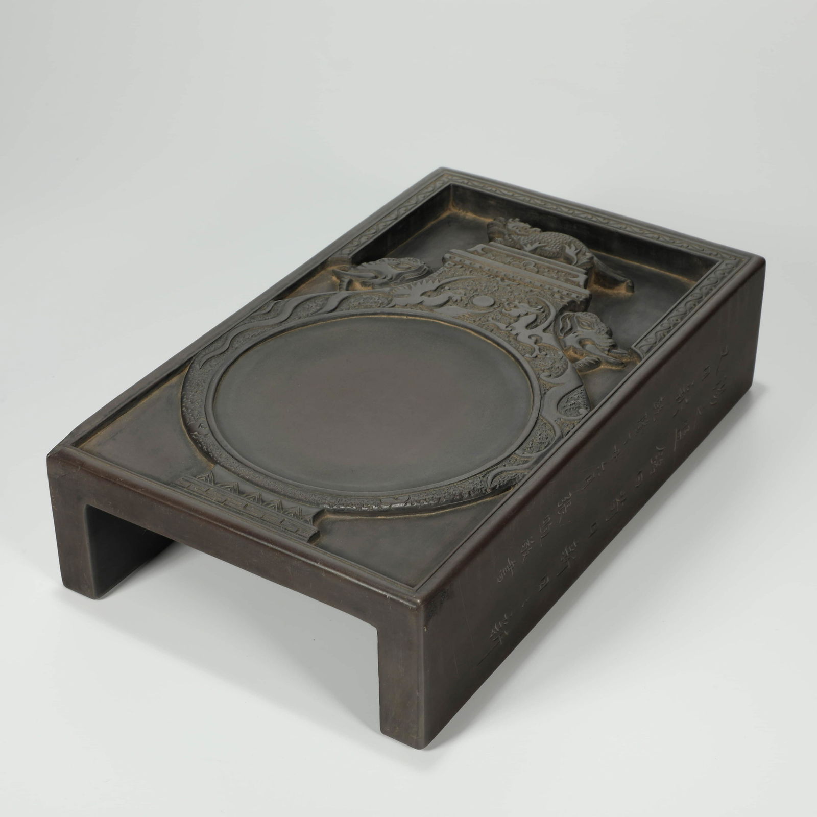 An Inscribed Dragon and Phoenix Duan Inkstone: An Inscribed Dragon and Phoenix Duan Inkstone Length:24.5cm, Width:14.6cm, Height:5.7cm,