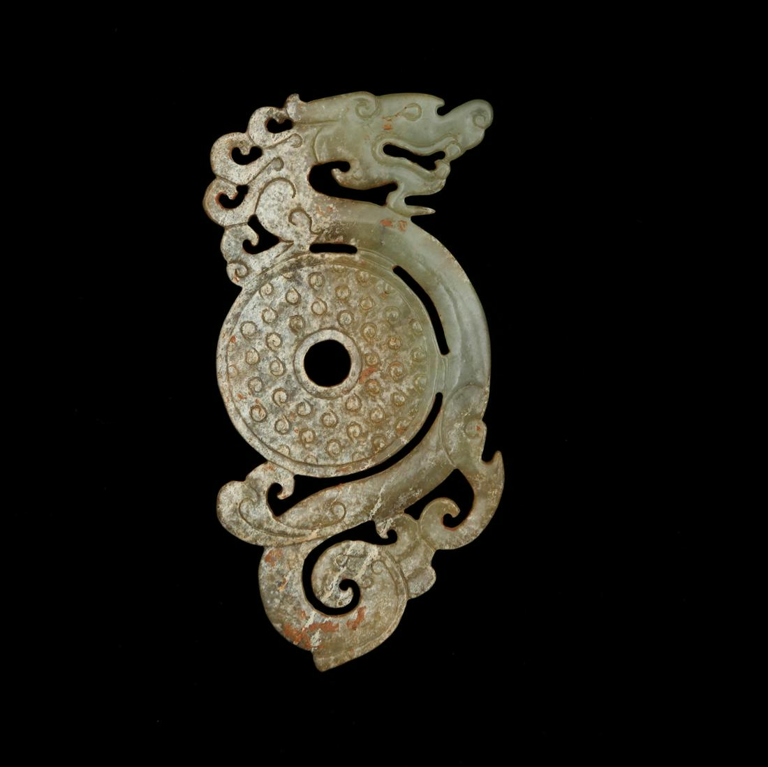 A Dragon Carved Jade Bi: A Dragon Carved Jade Bi Length:12.3cm, Width:6.2cm,