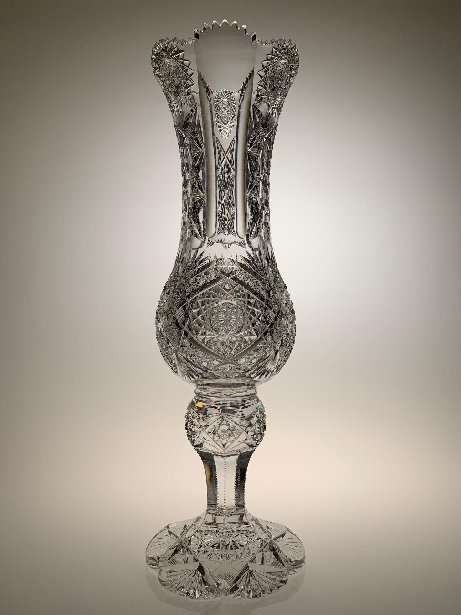 J. Hoare Cut Glass 17.5" Footed Vase: American Brilliant cut glass footed vase. This piece was most likely cut by J. Hoare. It has a great blank with a wood wheel polish. Large heavy petticoat foot with cut pattern is typical for J. Hoare