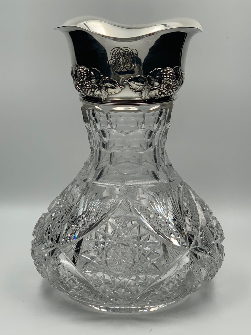 Maple City Cut Glass Vase Gorham Sterling Collar: American Brilliant cut glass vase signed by Maple City. This vase is large with a bulbous shape. The sterling collar has a ruffled top edge and is marked Gorham. Glass is cut with St. Louis diamonds o