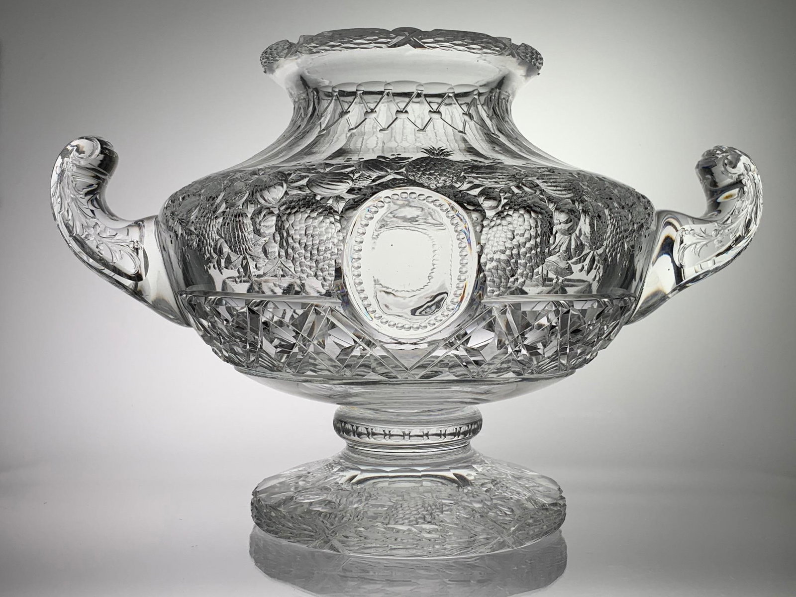 Signed Webb English Intaglio Cut Glass 2 Handled Urn: This is an outstanding example of English intaglio cutting by Thos. Webb at their best. It is very heavy with a large heavy foot cut with pattern on bottom. The applied handles are also cut. The urn i