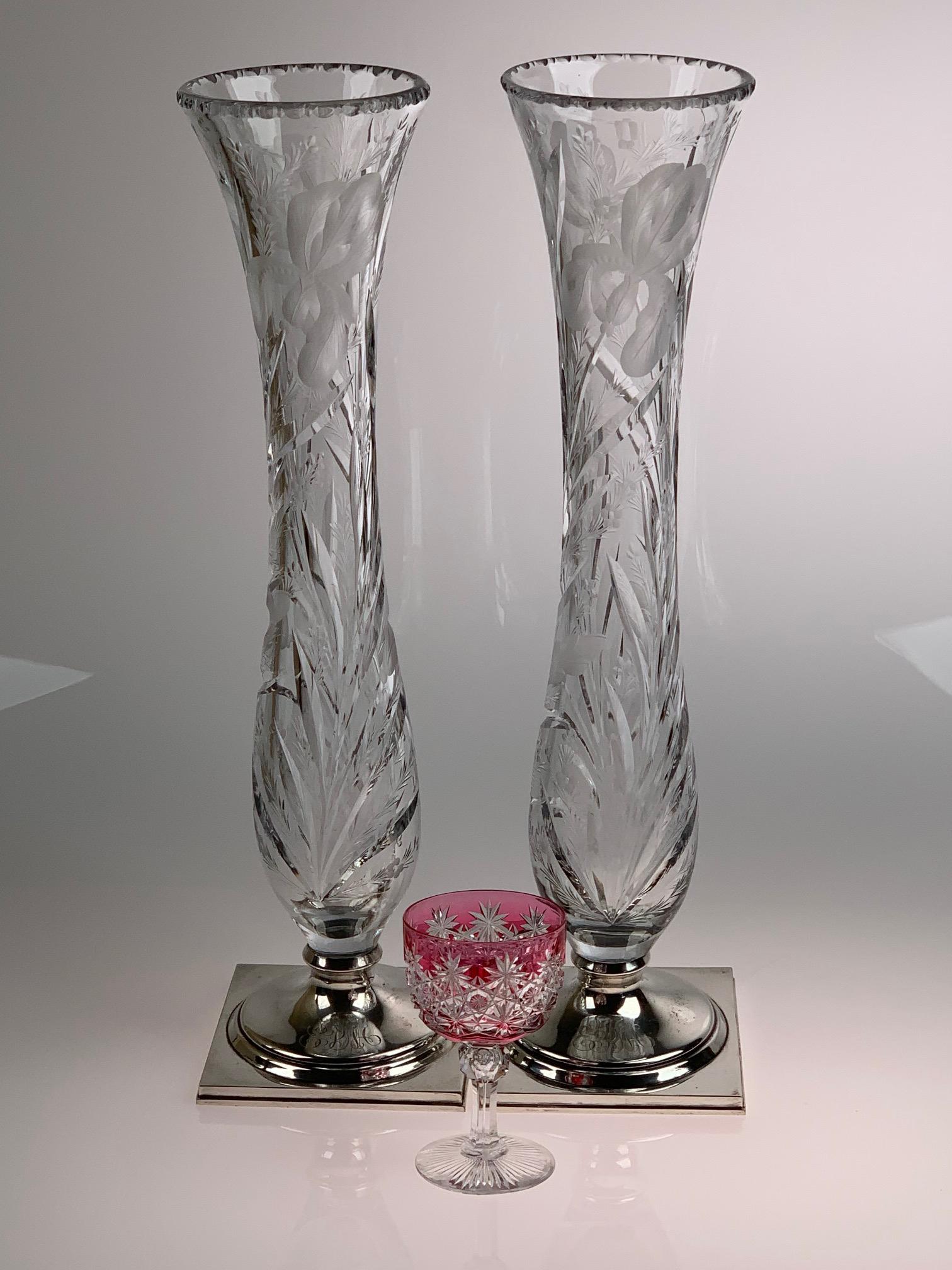 Signed Hawkes Iris Cut Glass Pair Vases With Sterling: Matched pair of cut glass vases by the T. G. Hawkes Company in their intaglio Iris design. Each vase is cut with two iris. Both are signed Hawkes on the glass and have square sterling bases. (Wine ste