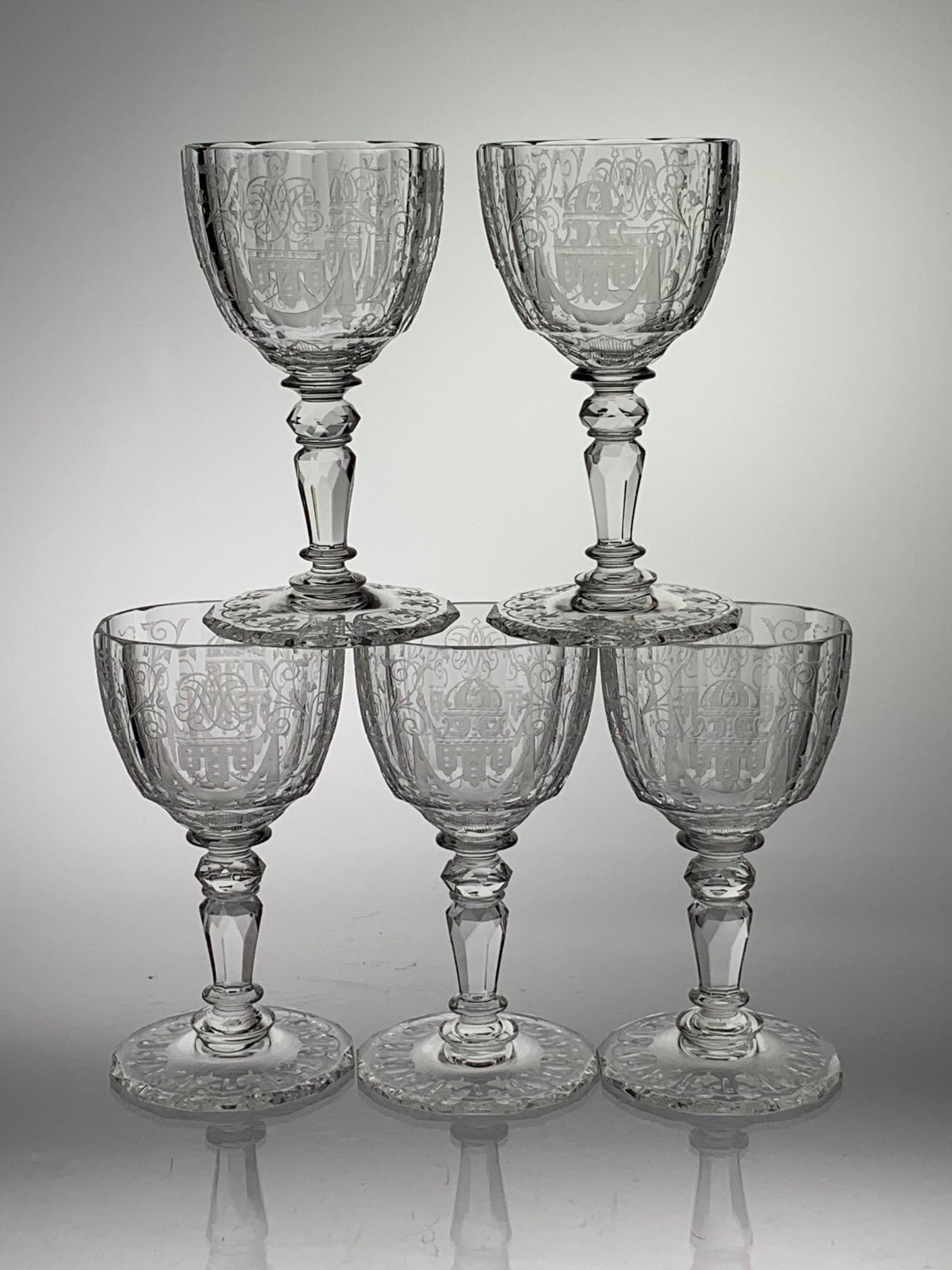 Set 5 Engraved Cut Glass Oval Wines Signed By Lobmeyr: This is a set of 5 cut glass oval wines; bowls cut with a flute shape and then decorated with engraved design. Stem is cut and round base is cut with pattern design also. All are signed Lobmeyr. Each 