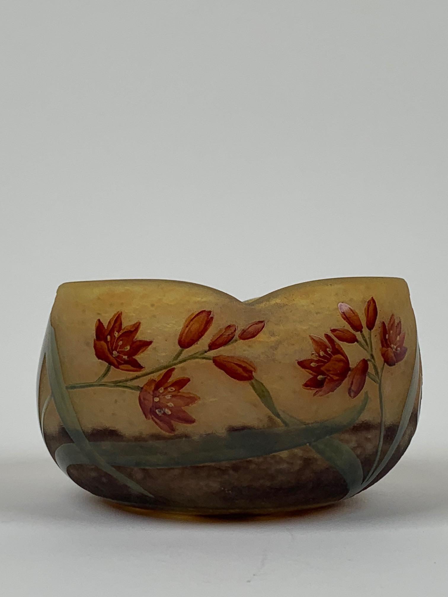 Daum Nancy Cameo Enameled Art Glass Crimped Bowl: French cameo art glass bowl has enameled floral decoration. Crimped around the rim. Signed DAUM NANCY. Circa 1900's. Approx. dimensions: 2 1/2" h. x 5 1/4" dia. (6.35cm x 13.3cm)