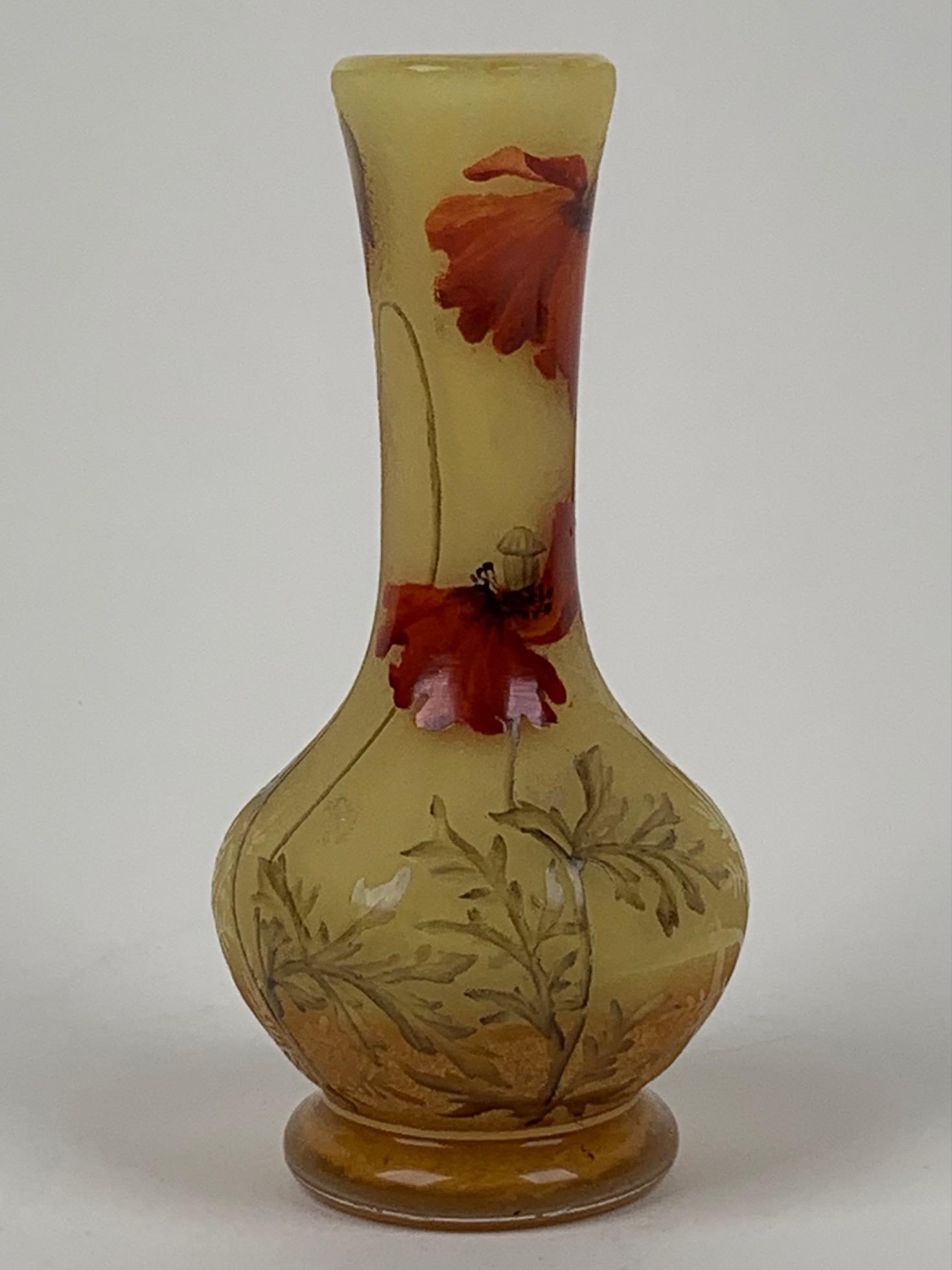 Daum Nancy Cameo Art Glass Vase With Poppies: Signed DAUM NANCY. French cameo art glass small footed vase. Floral design with poppies. Circa 1910. Approx. dimensions: 5" h. x 2 1/2" dia. (12.7cm x 6.35cm)