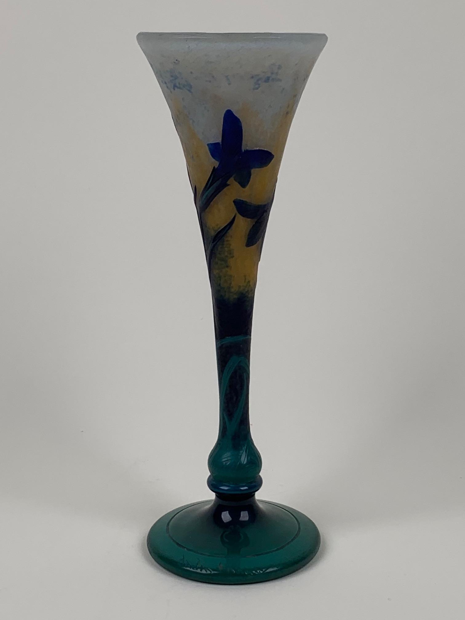 Daum Nancy French Cameo Art Glass Vase: French cameo art glass vase signed by DAUM NANCY. Deep green base with rich blue flowers. Circa 1910. Dimensions: 10" h. x 3 1/4" dia. (25.4cm x 8.25cm)