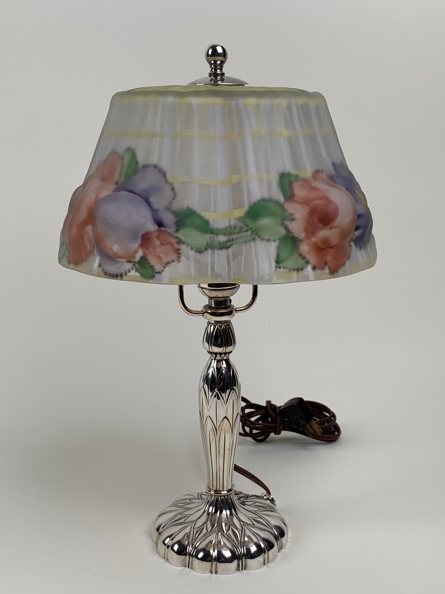Pairpoint Puffy Boudoir Lamp: Pairpoint puffy boudoir lamp. This lamp is puffy where the flowers are and is reverse painted on the inside of the shade. It has a Pairpoint Stratford shade with a floral border and lattice decoration