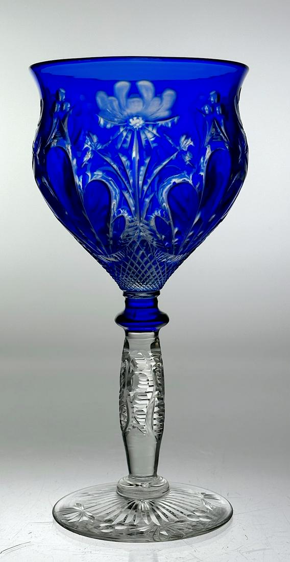 Stevens & Williams Cut Glass Wine Stem Cobalt To Clear: Beautiful cut glass wine stem by Stevens & Williams. Has a nice cobalt blue color cut to clear. Has a finger and floral design. There is cutting on the stem and foot also. Circa 1900 Dimensions: 6.25"