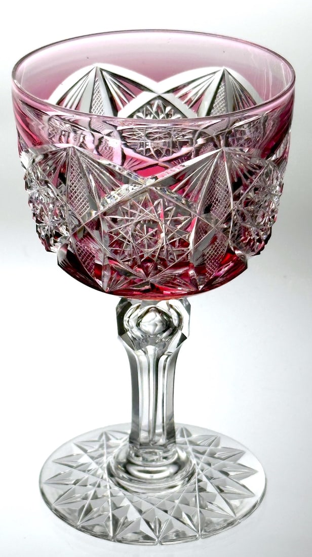 ABP Cut Glass Red-Clear Wine Stem Dorflinger No. 293: American Brilliant cut glass wine stem in red cut to clear. This piece is cut in pattern No. 293 by Dorflinger. The design has hobstars and reverse fans. The fluted stem has a long tear drop and a fac