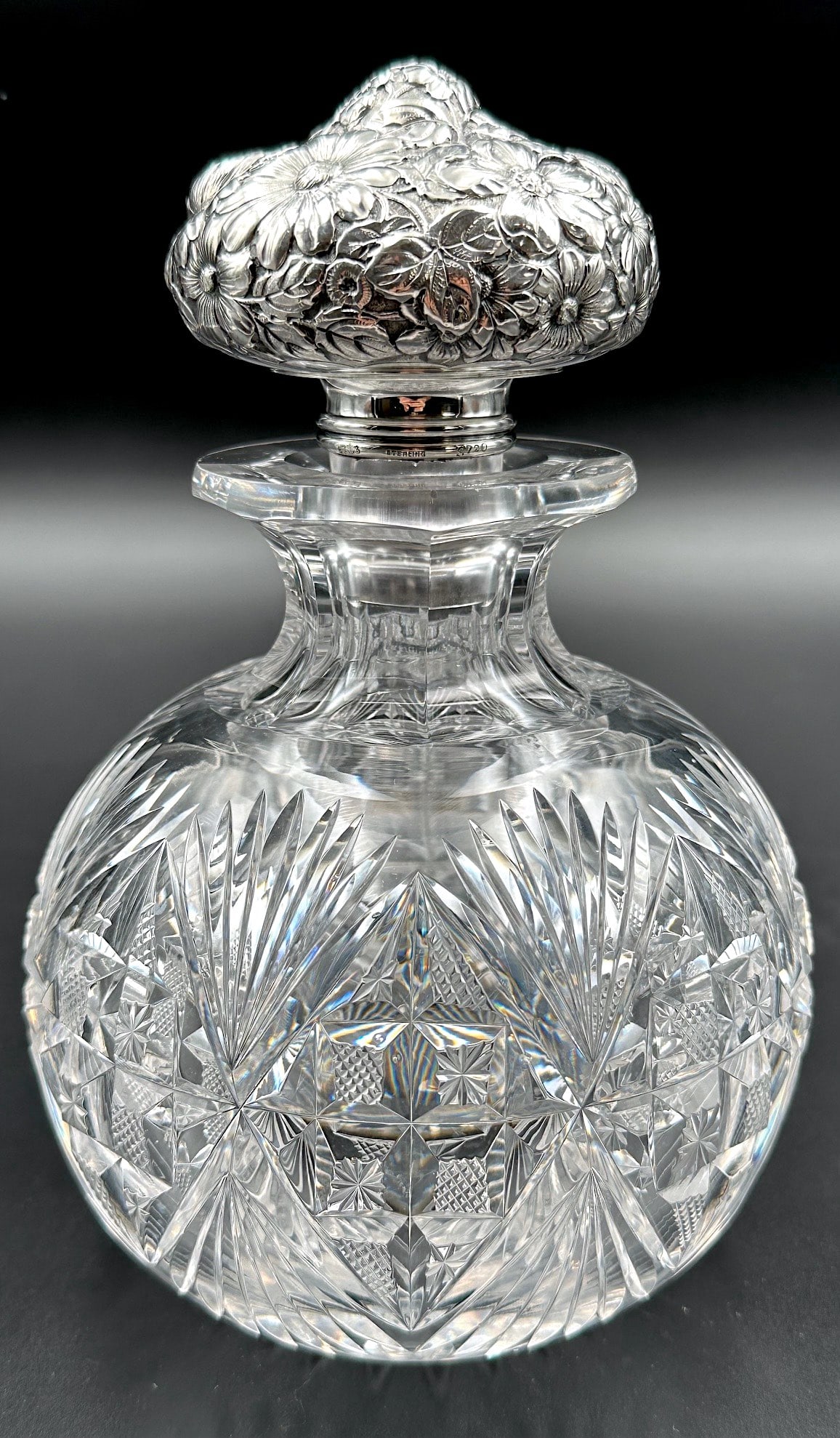 Oversized Dorflinger Royal Cut Glass Cologne Gorham Sterling: This is a large and handsome cut glass cologne or perfume bottle from the American Brilliant period. It is cut by Dorflinger in their Royal pattern. It has a fine water white blank from Dorflinger wit