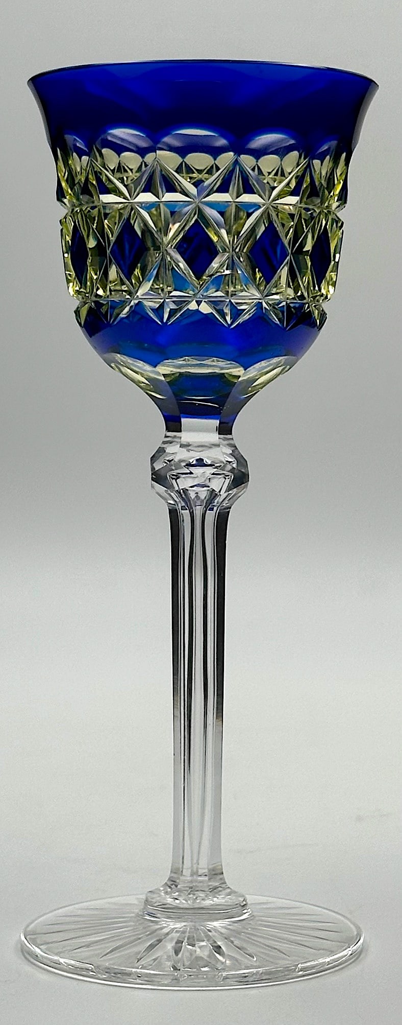 Val St. Lambert Carolton Cut Glass 3 Color Hock Wine: A gorgeous cut glass hock wine by Val St. Lambert in their Carolton pattern. This piece has a beautiful dark cobalt color over uranium vaseline. The clear stem is fluted with a long tear drop and a fa