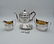 GEORGE III THREE PIECE SILVER TEA SET WITH TRIVET