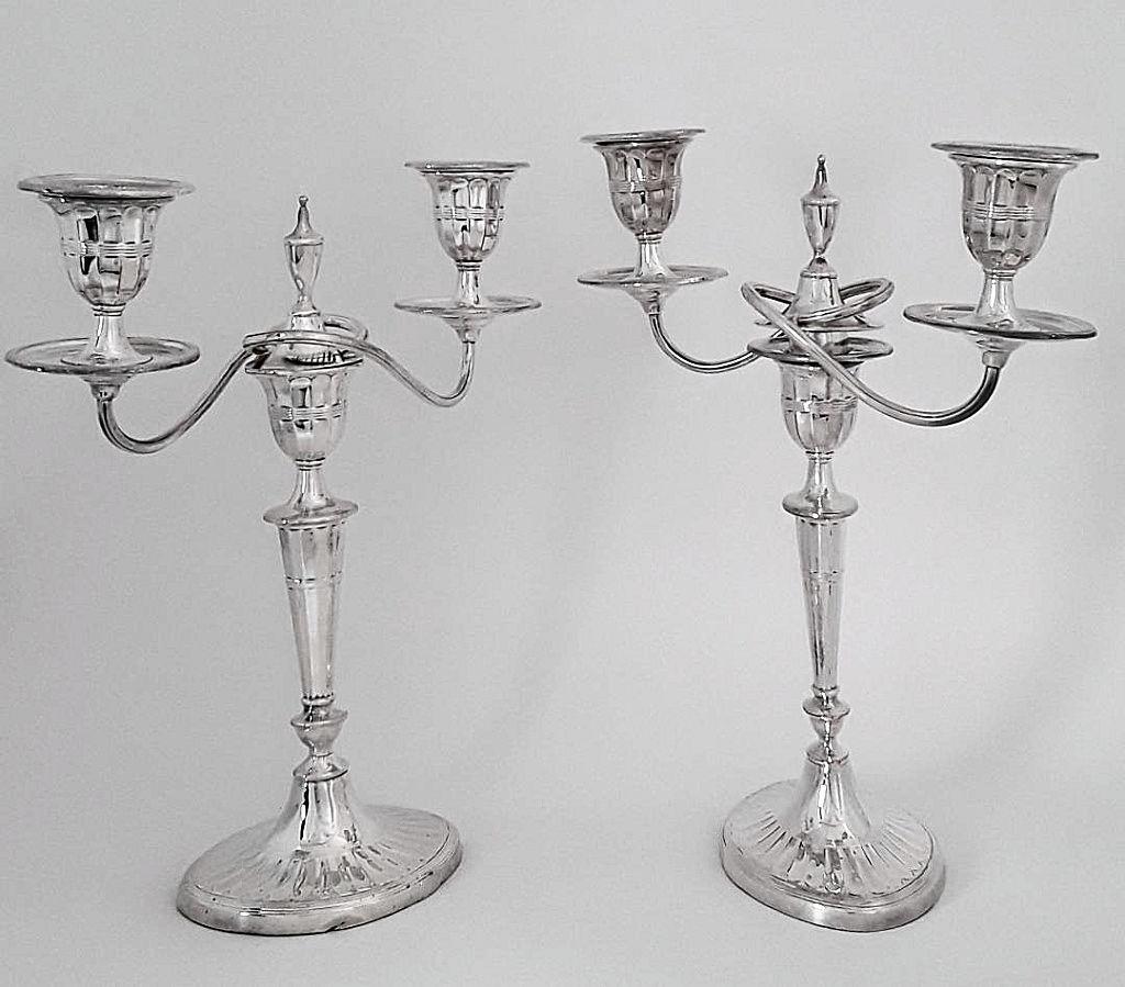 PAIR OF SILVERPLATED CANDELABRA: English, mid 20th century Two branch convertible to candlesticks 11.75"h x 9.25" w