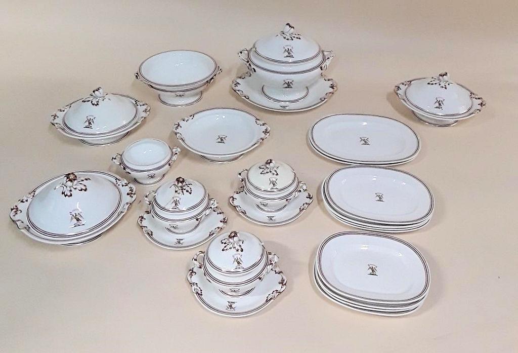 EXTENSIVE 19TH CENTURY CRESTED DINNER SERVICE: English, circa mid 19th century No maker's mark Elegant porcelain service with a crest of a sea hawk holding a fish and "Tento" motto 48, dinner plates - 10"; 39 luncheon plates - 9"; 13 dessert plate