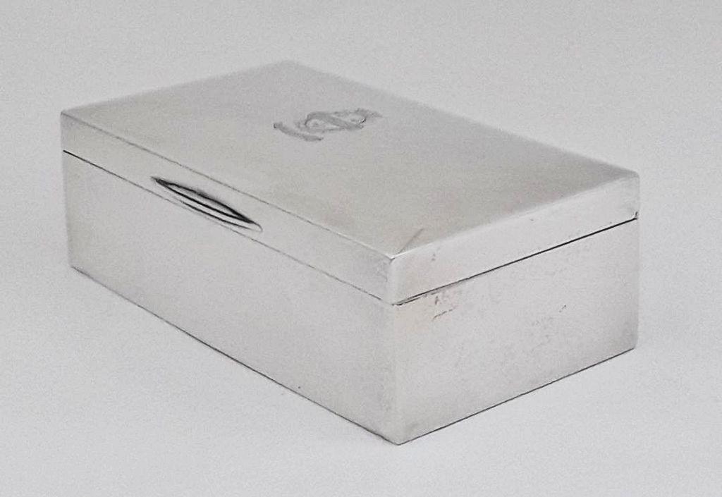 CRESTED STERLING SILVER TABLE BOX: Birmingham, 1928 Maker: W. H. Hasler Ltd. 2.25" h x 6.5" w x 3.5" d 454 grams total weight