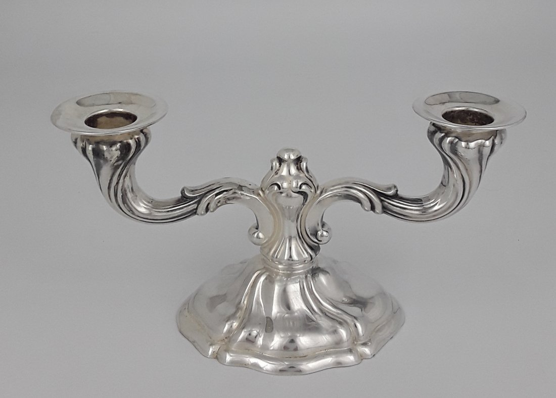VINTAGE GERMAN SILVER CANDELABRUM: German, Baden-Wurttemberg, circa 2nd quarter 20th century Maker: Emil Hermann Waldstetten. Elegant two light silver candelabrum with flowing lines to base and stylized flowers forming the arms and sup