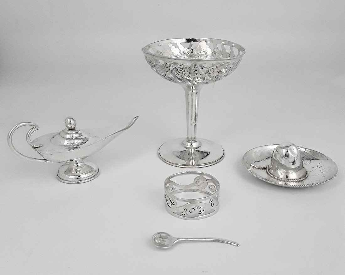 STERLING SILVER GROUPING: Five silver items including a decorative Mexican silver sombrero and small oil "lamp", along with a silver salt spoon, napkin ring, and a footed, pierced dish/vase having various makers and dates. 138