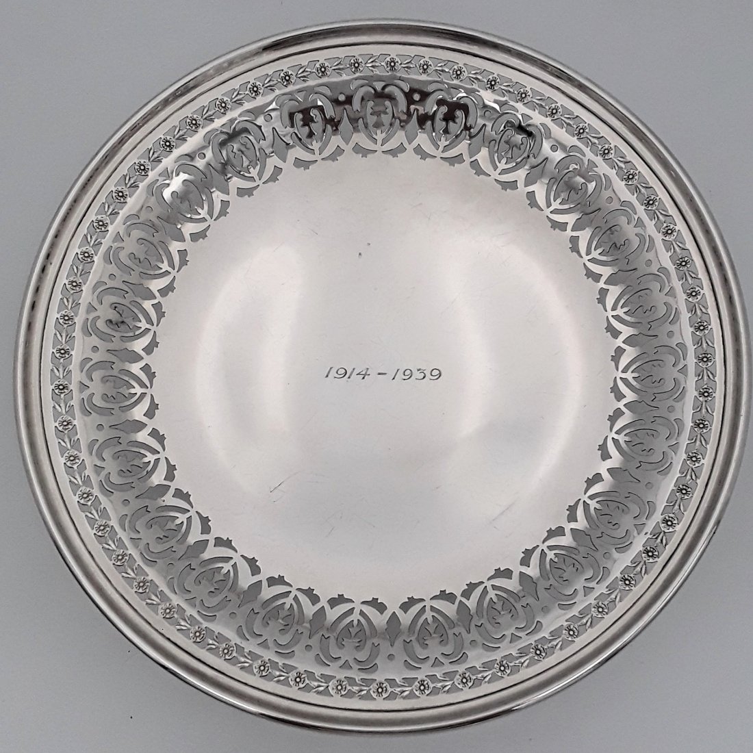 VINTAGE BIRKS STERLING COMPORT: Montreal, Canada, date letter for 1936, Henry Birks and Sons Attractively pierced with a floral and stylized heart design with the centre having engraved dates 1914 - 1939 1.5" x 9" diameter, 334 gram