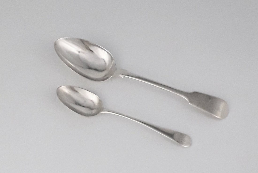 TWO GEORGIAN SILVER SPOONS: Tablespoon; London,1835 Maker: Joseph and Albert Savory, Fiddle pattern Dessert spoon, London 1796 Maker: Thomas Wallis II, Old English pattern 100 grams, 8.75" and 6.50"