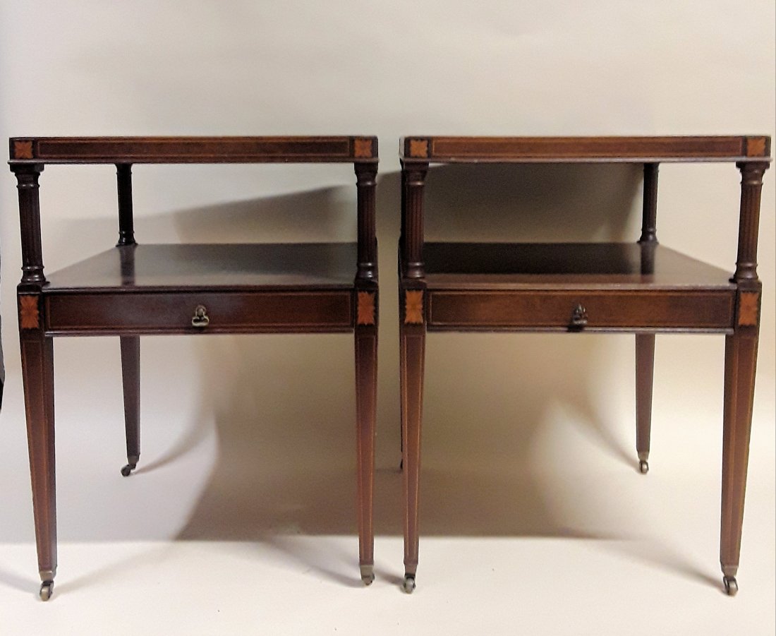 VINTAGE LEATHER TOPPED SIDE TABLES: Circa 1930s Good quality pair of square mahogany tables each with a single drawer and nice inlay work to sides and tapered square legs. Original casters. 26.5" h x 20" w x 20d