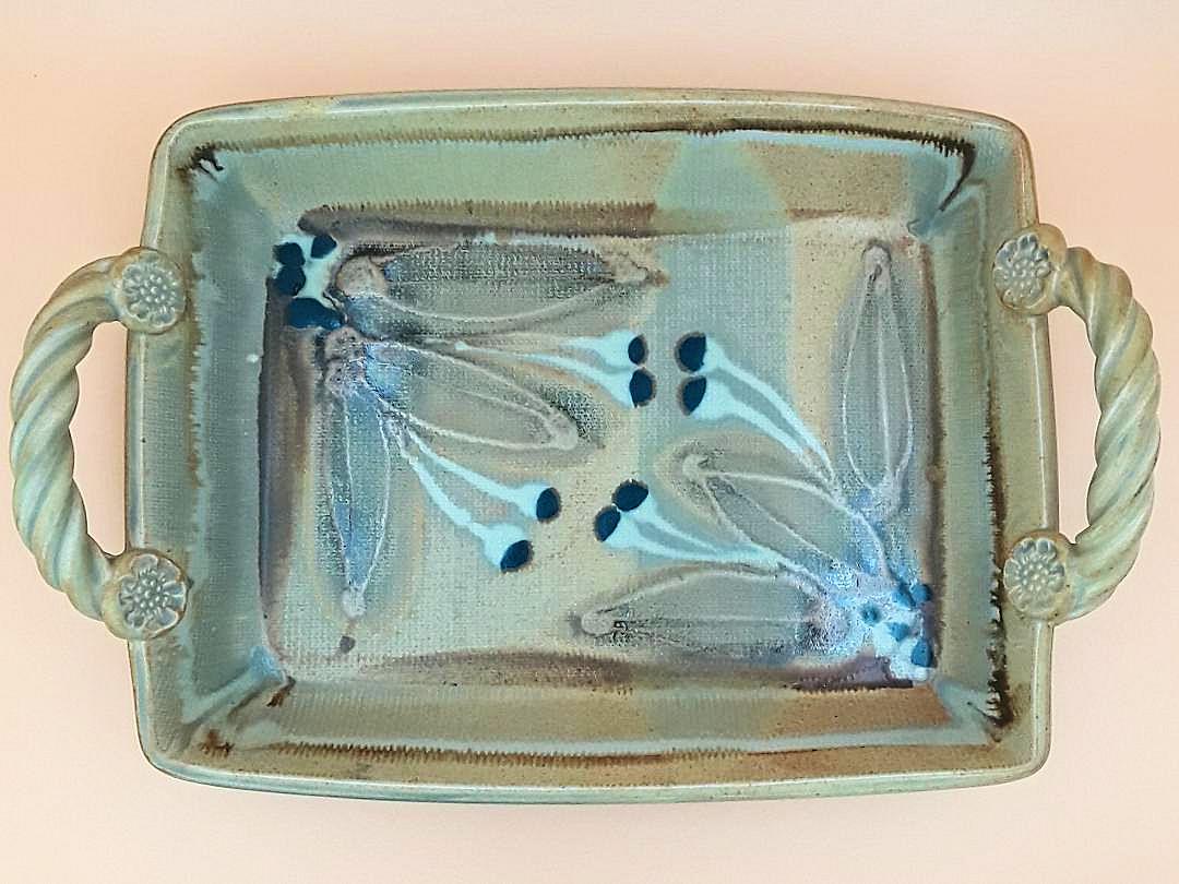 RARE CHOSIN ART POTTERY PAINTED TRAY: Canadian, late 20th century Maker: Robin Hopper R.C.A. 1939 - 2017 Nicely painted two-handled ceramic tray with ceramic "rope" handles and a painted floral interior. 4" h x 16" w x 10.5 d