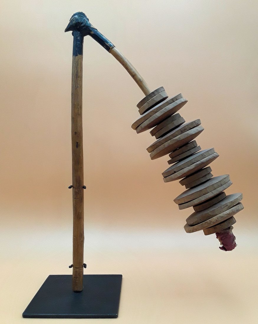VINTAGE AFRICAN WASEMBE RATTLE: Authentic hand-made African Wasembe rattle (likely from Ghana), nicely mounted on a custom black metal display stand. The rattle creates a loud striking sound when the gourd slices clack together usin