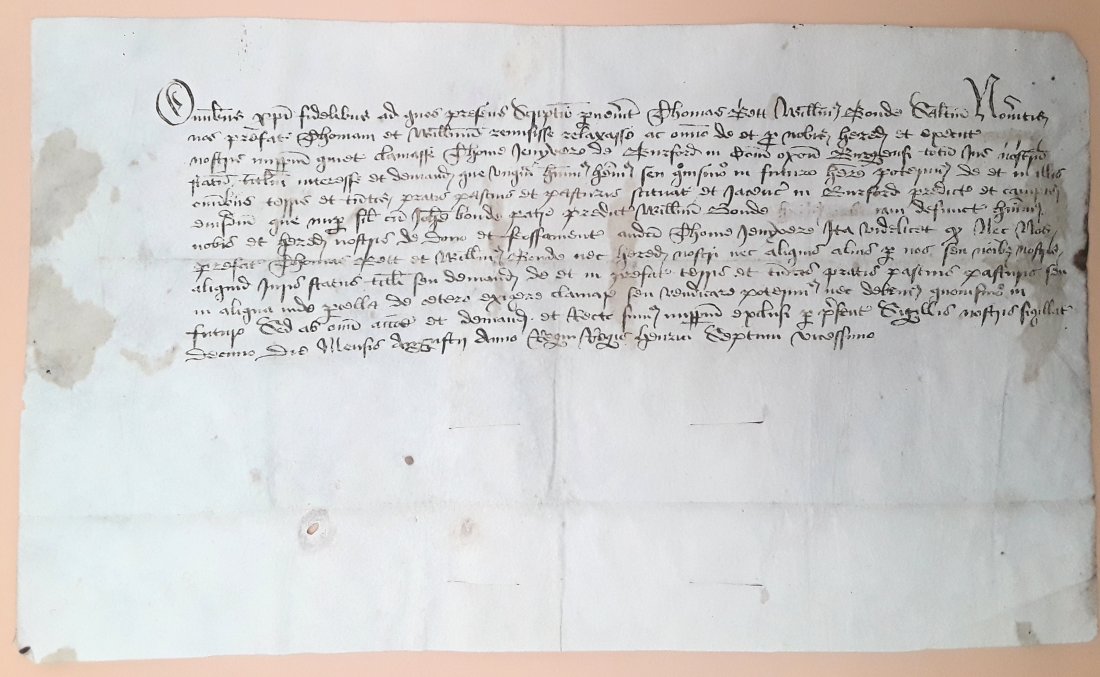 TUDOR PERIOD ENGLISH LAND DEED: This document is a formal transfer from Thomas Bett and William Bond their right to an estate in Burford to Thomas Jenison. Expert view is that it is dated 1505 being marked as the twentieth year of t