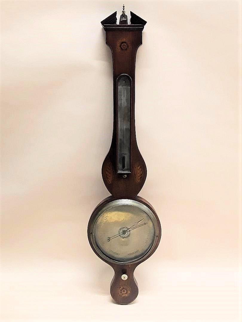 EARLY 19TH CENTURY "BANJO" WHEEL BAROMETER: English, circa 1820s In excellent working condition; the mahogany case havimng shell inlays and stringing; the face exhibiting traces of silver; signed Piotti, active in London from 1823. 38" x 10"