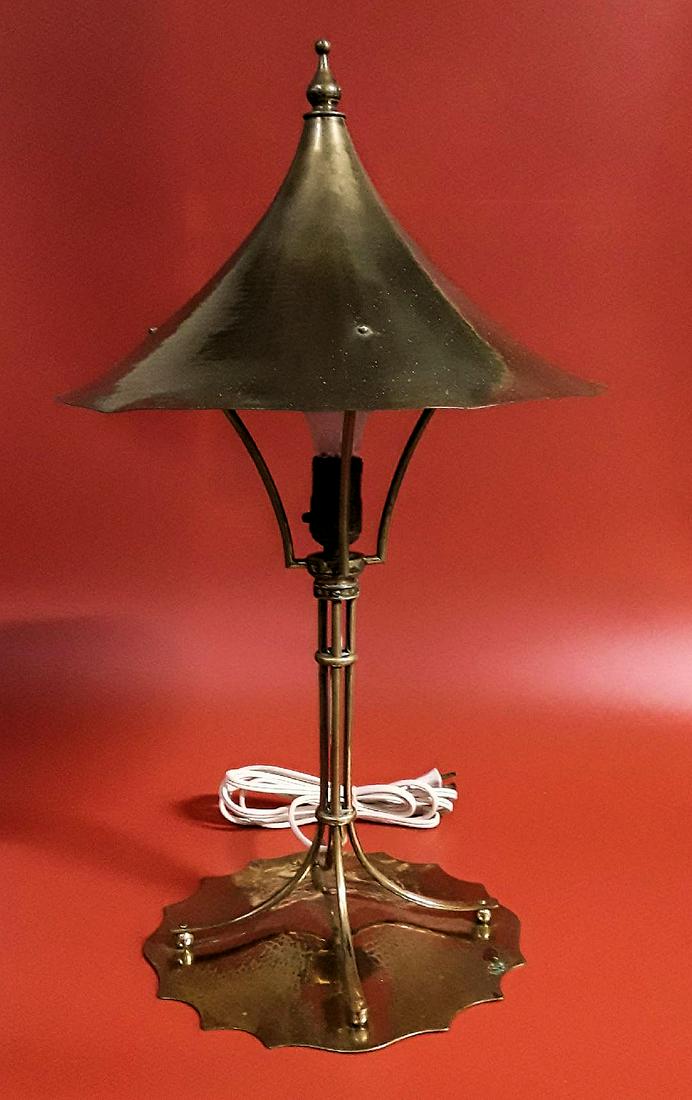 ARTISANAL BRASS TABLE LAMP: Attractive brass conical shade supported by four spreading poles on a flat hammered base. 23" x 13"