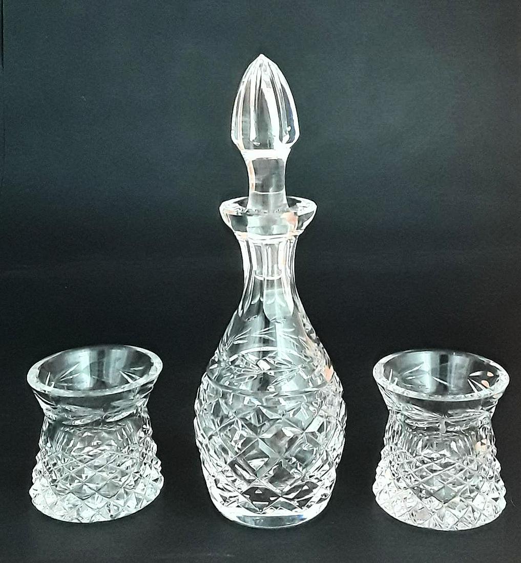 VINTAGE WATERFORD DECANTER AND HOLDERS: Irish, last quarter 20th century Fine mouth-blown, hand cut crystal decanter, stopper and two toothpick holders. No chips or cracks. 8" h x 3" and 2.25" h x 2.5"