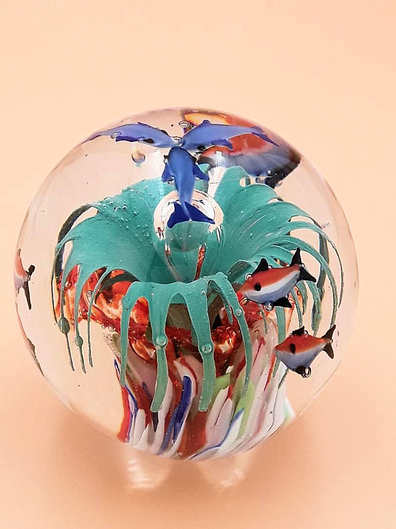 MURANO "AQUARIUM" PAPERWEIGHT: Italian, mid 20th century A lovely art glass paperweight with colourful fish swimming in an underwater seascape with artfully created bubbles all encased in glass. 3.5" x 3.5"