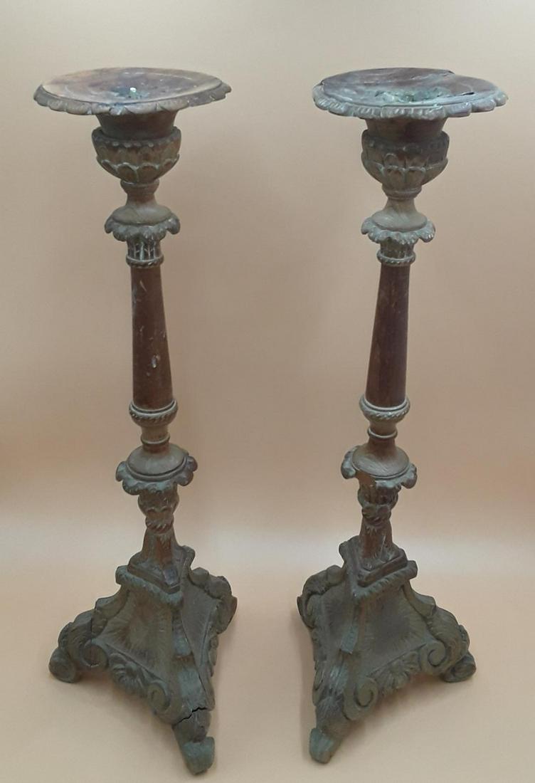 PAIR OF ANTIQUE CANDLE STANDS: Probably French, first half 19th century. Carved softwood in the baroque style. Repairs to top but nonetheless decorative. 23.5" x 8"