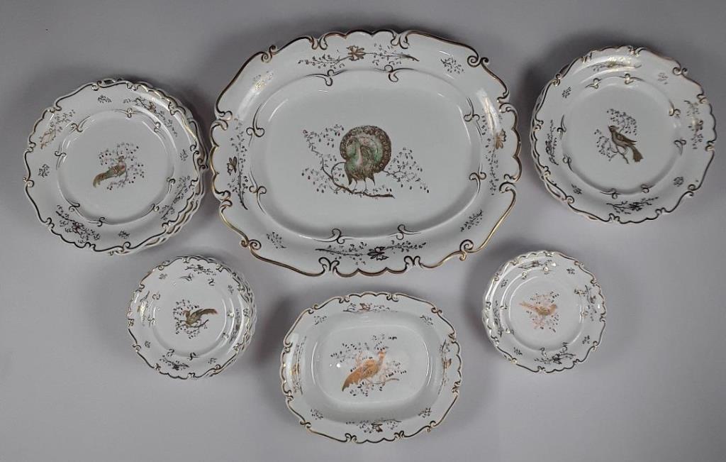 EARLY 19TH CENTURY PART DINNER SERVICE: English, possibly early Victorian Painted peacock and peahen centres Platter 18.5' x 14.5"; 6 x 10.5" dinner plates; 7 x luncheon plates.