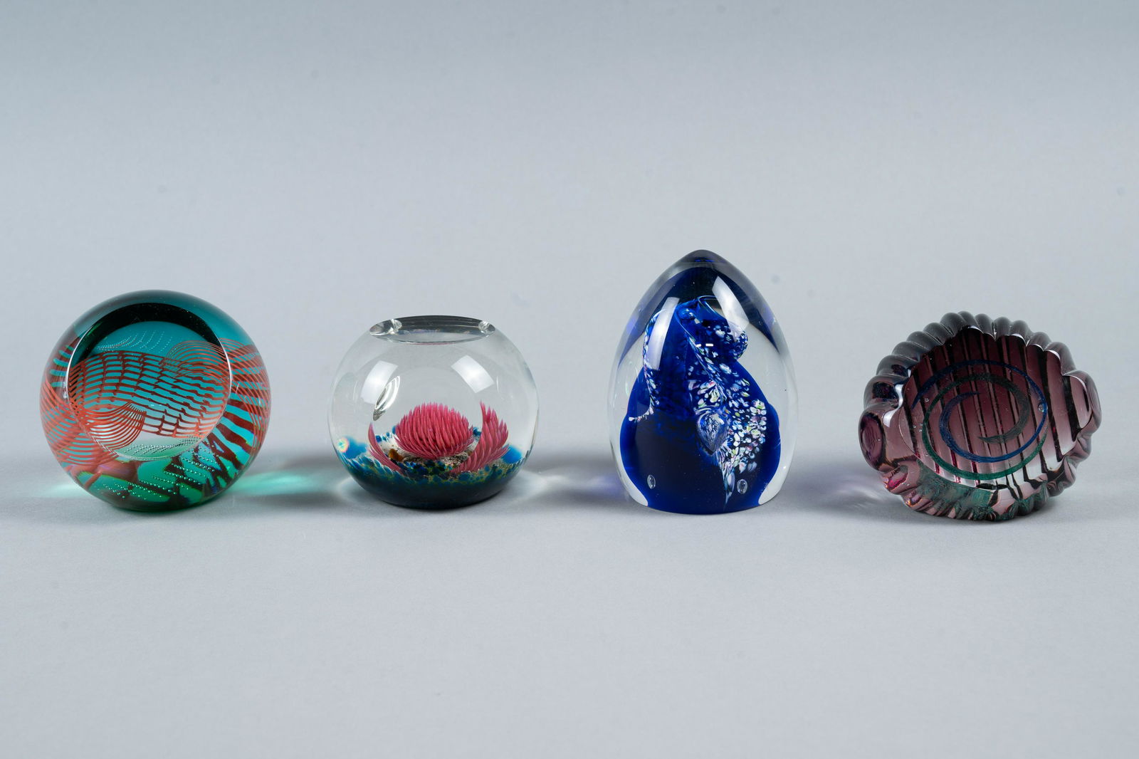 FOUR VINTAGE GLASS PAPERWEIGHTS (1 of 6)